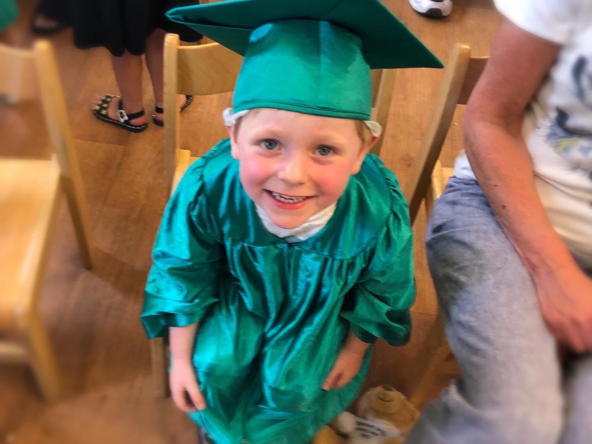 Robbie smiling on his graduation day from Chestnut Grove nursery